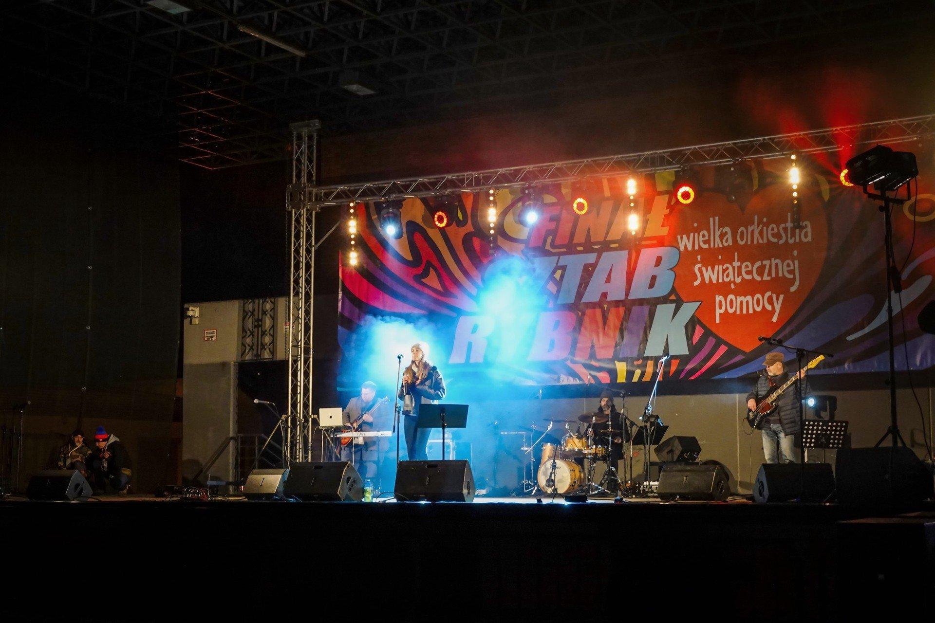 A band performs on stage during a concert at the 31st WOŚP Finale in Rybnik.