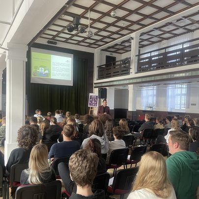 Participants are seated in the hall during a presentation as part of the SWT Academy.