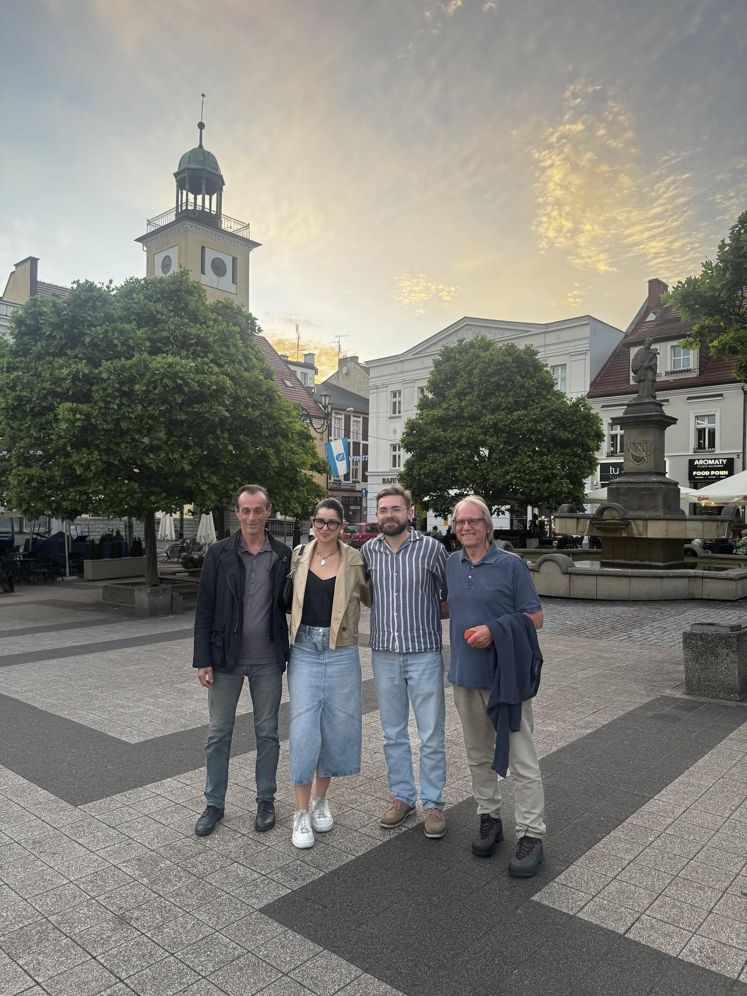 Four participants in the Polish–Norwegian study visit standing in Rybnik market square