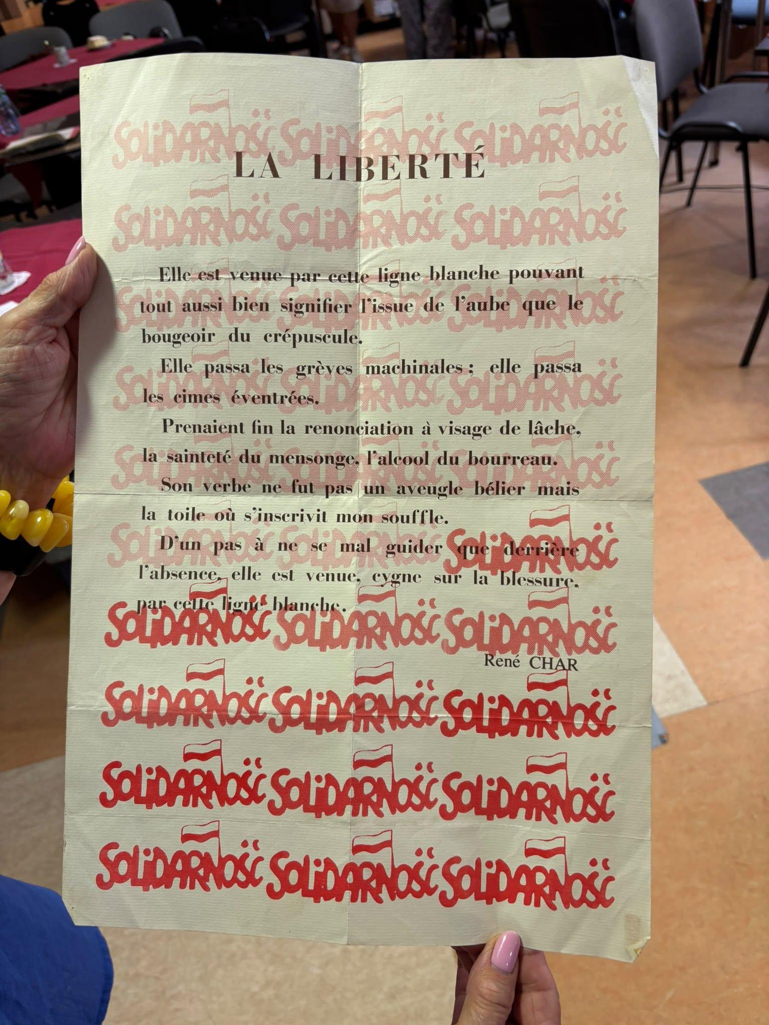 A French-language “La Liberté” poster featuring repeated Solidarity marks
