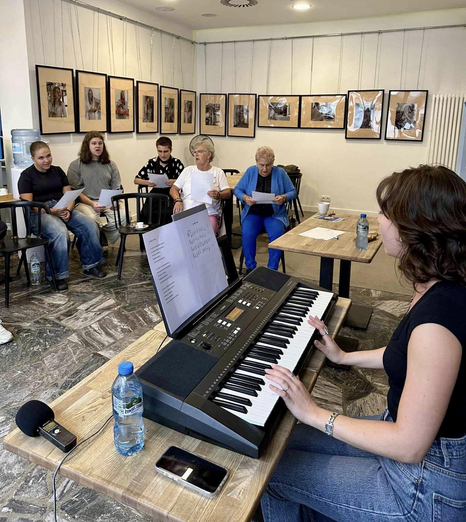 A ceramic tile with a red flower made during the project workshops.